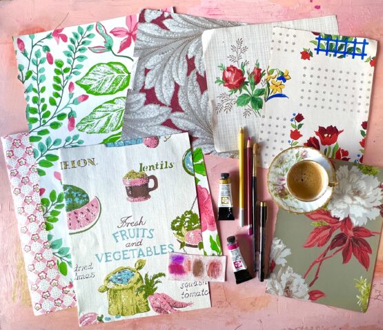 Flatlay IMG 8158 vintage fabrics, pencils and a teacup on a desk