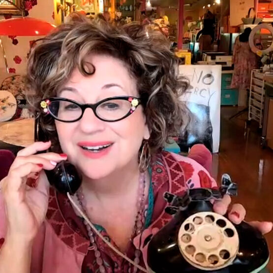 Lilla headshot with vintage phone Lilla headshot with vintage phone